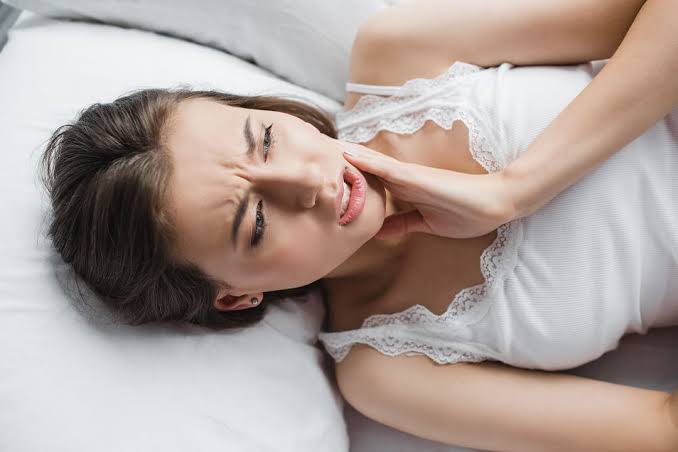 Why Does My Tooth Hurt When I Lay Down? What It Means 2026