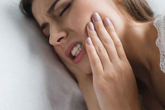 Why Does My Tooth Hurt When I Lay Down? What It Means 2026